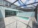 Outdoor enjoyment is enhanced with a screened pool area featuring stylish pool and paver patio at 1286 Shoreside St, Clermont, FL 34714