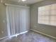 Bedroom featuring a ceiling fan, tiled floors, and sliding glass doors to the exterior at 14001 Fairway Island Dr # 513, Orlando, FL 32837