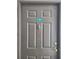Close-up of the gray front door with a door knocker and unit number 513 at 14001 Fairway Island Dr # 513, Orlando, FL 32837