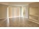 Bright living room featuring tiled floors, large sliding doors to patio and built in display shelves at 14001 Fairway Island Dr # 513, Orlando, FL 32837