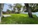 Expansive backyard featuring a combination of lush greenery, a wooden fence, and ample space for outdoor activities at 1412 Pine St, Orlando, FL 32824