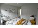 This stylish bedroom offers a cozy workspace, a plush rug, and a comfortable bed at 1412 Pine St, Orlando, FL 32824