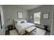 Bright bedroom featuring natural light, neutral decor and stylish gray vinyl plank flooring at 1412 Pine St, Orlando, FL 32824
