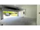 Spacious two-car garage featuring an open door with natural light and gray walls for convenient parking at 1412 Pine St, Orlando, FL 32824