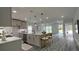 Modern kitchen with a central island, pendant lighting, and stainless steel appliances at 1412 Pine St, Orlando, FL 32824