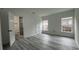Bright main bedroom with ensuite bathroom and wood flooring at 1412 Pine St, Orlando, FL 32824