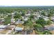 Aerial view showcases a neighborhood with trees, houses, and a school bus; community living at 14120 Rutgers Ave, Orlando, FL 32826