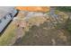 Backyard fire pit with stumps and grass, perfect for outdoor gatherings by the house at 14120 Rutgers Ave, Orlando, FL 32826