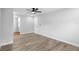 Bright bedroom with wood-look floors and neutral walls at 14120 Rutgers Ave, Orlando, FL 32826