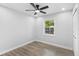 This bright bedroom features new flooring, neutral paint, and a ceiling fan at 14120 Rutgers Ave, Orlando, FL 32826