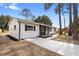 Charming single-story home showcasing a fresh exterior with updated landscaping and a spacious driveway at 14120 Rutgers Ave, Orlando, FL 32826