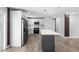 Contemporary kitchen with stainless appliances, grey island, and white cabinets at 14120 Rutgers Ave, Orlando, FL 32826