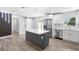 Modern kitchen featuring stainless steel appliances, quartz countertops, and a center island at 14120 Rutgers Ave, Orlando, FL 32826