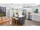 Bright kitchen features white cabinets, stainless steel appliances, and a large center island with breakfast bar at 14120 Rutgers Ave, Orlando, FL 32826