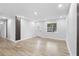 Well-lit living room with neutral paint, modern light fixtures, and new flooring at 14120 Rutgers Ave, Orlando, FL 32826