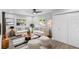 Cozy living room with modern furnishings, wood-look floors, and natural light at 14120 Rutgers Ave, Orlando, FL 32826
