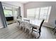 Bright dining room features neutral walls and a white table at 143 Windsor Pl, Davenport, FL 33896