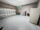 Spacious garage with sealed epoxy flooring, overhead lighting, and plenty of room for storage and projects at 143 Windsor Pl, Davenport, FL 33896