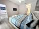 Serene main bedroom features a ceiling fan and ensuite bathroom at 143 Windsor Pl, Davenport, FL 33896