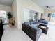 Relaxing patio featuring comfortable seating, ceiling fans, and a tranquil view of the backyard pool at 143 Windsor Pl, Davenport, FL 33896