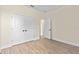 An airy bedroom features hardwood floors and closet with double doors at 14470 Sw 46Th Ct, Ocala, FL 34473
