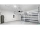 A spacious garage with white walls and a new garage door at 14470 Sw 46Th Ct, Ocala, FL 34473