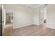 Spacious living area with hardwood floors, neutral walls, and access to other rooms at 14470 Sw 46Th Ct, Ocala, FL 34473