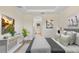 Tranquil primary bedroom with a tray ceiling and calming decor at 14470 Sw 46Th Ct, Ocala, FL 34473