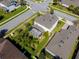 Aerial view of a home featuring a screened-in patio and lush, landscaped backyard in a residential neighborhood at 14518 Black Quill Dr, Winter Garden, FL 34787
