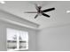 Bright bedroom featuring a modern ceiling fan and a large window for natural light at 14518 Black Quill Dr, Winter Garden, FL 34787