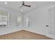 Cozy bedroom with hardwood floors, a ceiling fan, and plenty of natural light at 14518 Black Quill Dr, Winter Garden, FL 34787