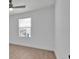Bright bedroom with a large window, ceiling fan, and neutral paint at 14518 Black Quill Dr, Winter Garden, FL 34787