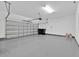 Clean and spacious garage with epoxy flooring and an automatic garage door opener at 14518 Black Quill Dr, Winter Garden, FL 34787