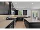 Spacious kitchen featuring stainless steel appliances, light countertops, and island with barstool seating at 14518 Black Quill Dr, Winter Garden, FL 34787