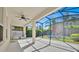 Covered outdoor lanai with a ceiling fan, a built-in grilling station, and a view of the backyard at 14518 Black Quill Dr, Winter Garden, FL 34787