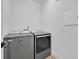 Functional laundry room with modern washer and dryer units at 14518 Black Quill Dr, Winter Garden, FL 34787