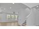 Bright and airy living room with hardwood floors and ample natural light at 14518 Black Quill Dr, Winter Garden, FL 34787
