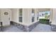 Covered porch with decorative stonework and a charming wreath on the front door at 14518 Black Quill Dr, Winter Garden, FL 34787