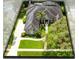 Aerial perspective of a house featuring a long driveway, mature landscaping, and partial view of the roof and backyard at 1525 Eagle Nest Cir, Winter Springs, FL 32708