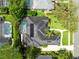 Overhead view showing a screened pool, solar panels, landscaping and backyard of the house at 1525 Eagle Nest Cir, Winter Springs, FL 32708