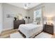 Cozy bedroom features a neutral color palette, wood floors, and plenty of natural light from the large window at 1525 Eagle Nest Cir, Winter Springs, FL 32708