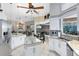 Spacious kitchen with granite countertops, stainless steel appliances, and a breakfast bar with seamless transition to living spaces at 1525 Eagle Nest Cir, Winter Springs, FL 32708
