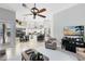 Open living space with tile floors, open concept kitchen, and backyard views at 1525 Eagle Nest Cir, Winter Springs, FL 32708