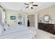 Main bedroom with ceiling fan, access to bathroom, and dresser at 1525 Eagle Nest Cir, Winter Springs, FL 32708