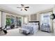 Bedroom featuring sliding glass doors to outdoor area, ceiling fan, neutral colors, and lots of light at 1525 Eagle Nest Cir, Winter Springs, FL 32708