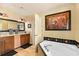 Bathroom with a double vanity, an entrance to the lavatory room, and a corner soaking tub at 1618 Pepperidge Dr, Orlando, FL 32806