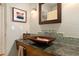 Stylish bathroom featuring vessel sink, mosaic tile backsplash, and granite countertop at 1618 Pepperidge Dr, Orlando, FL 32806