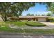 Charming home featuring mature trees, manicured landscaping, and a brick driveway at 1618 Pepperidge Dr, Orlando, FL 32806