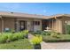 Charming home featuring lush landscaping, a brick walkway, and a decorative water fountain at 1618 Pepperidge Dr, Orlando, FL 32806