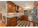 Well-lit kitchen with stainless steel appliances, sleek cabinetry, and decorative backsplash at 1618 Pepperidge Dr, Orlando, FL 32806